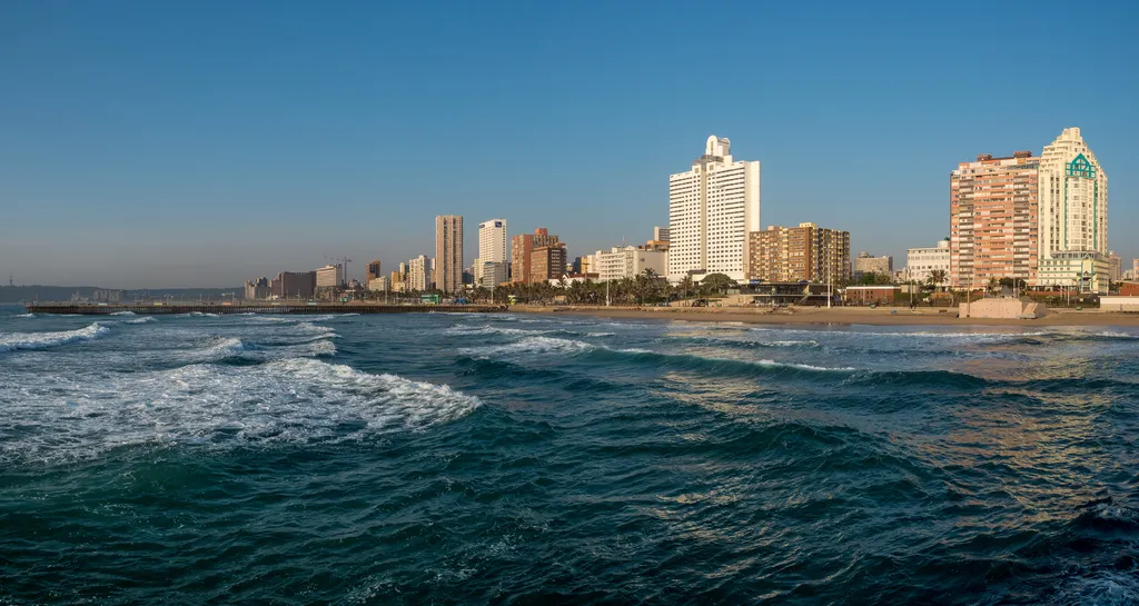 Waves rolling in at South Beach, Durban, with the city behind